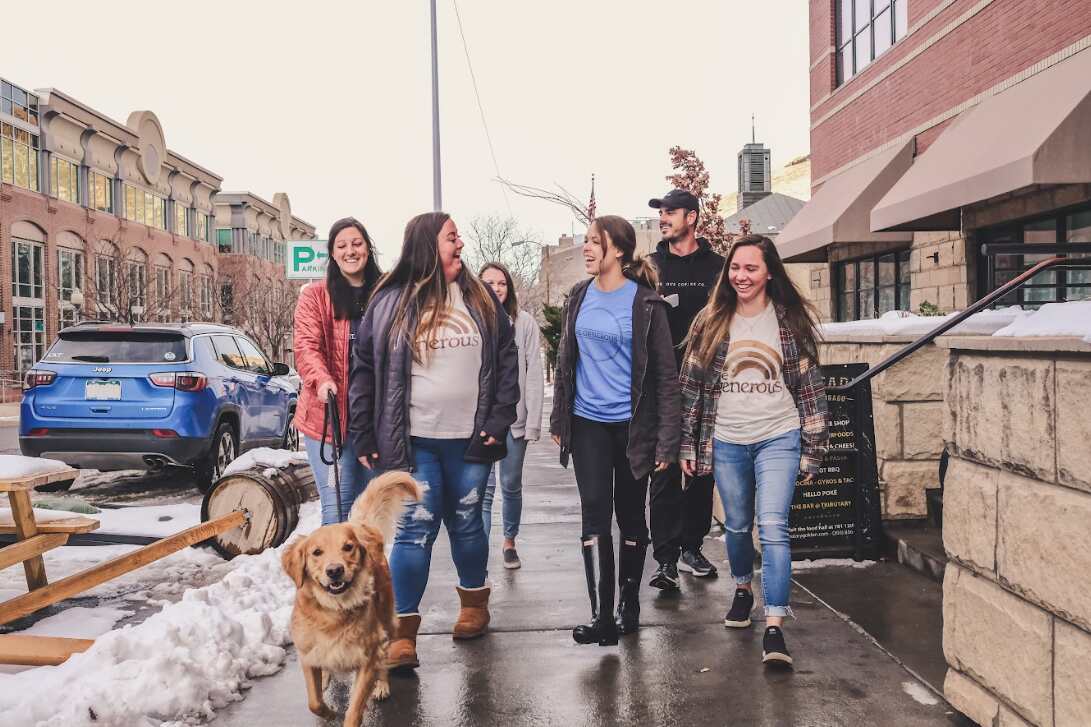 A group of friends walking down the street